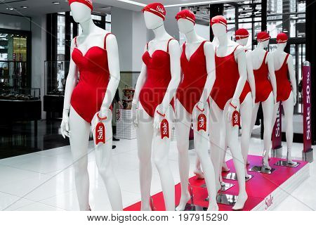 A Series Of Mannequins In Red Swimsuits.sale