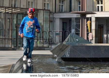 Ostrava Czech Republic 15 May 2015 Editorial photo of gipsy young boy which is running aroud fountain Ostrava Czech Republic