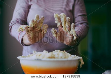 Close Up View Of Baker Kneading Dough. Homemade Bread. Hands Preparing Bread Dough On Wooden Table.