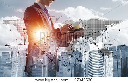 Double exposure of elegant businessman with diary in hands looking away
