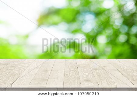Empty wooden table for product placement or montage with focus to table top in the foreground, with white background. Wooden board empty table perspective.