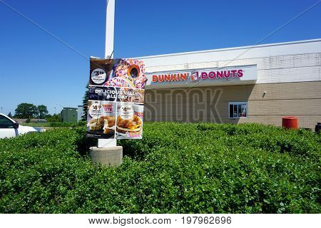 SOUTH HOLLAND, ILLINOIS / UNITED STATES - MAY 22, 2017: Dunkin' Donuts offers a drive-thru service at the Illinois Tollway's Chicago Southland Lincoln Oasis.