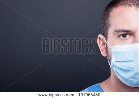 Close-up Half Face Of Medic Wearing Scrubs And Sterile Mask