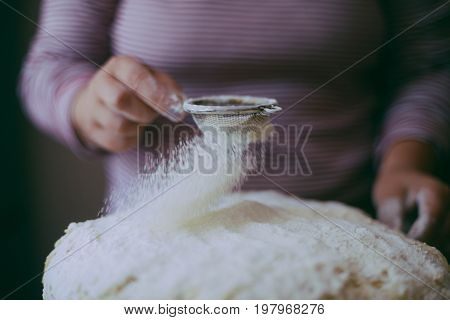 Close Up View Of Baker Kneading Dough. Homemade Bread. Hands Preparing Bread Dough On Wooden Table.