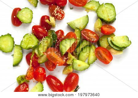 Vegetables, cucumbers and tomatoes on a white background
