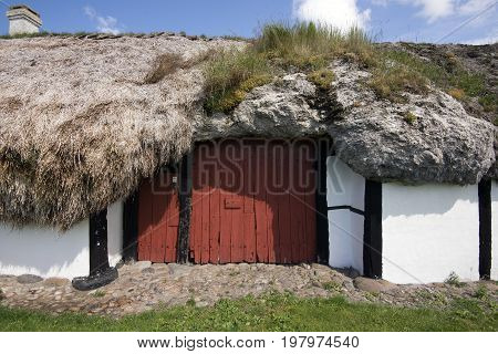 LAESOE DENMARK - JULY 26 2017: Seaweed roof farm museum called Heather Farm Laesoe 2017