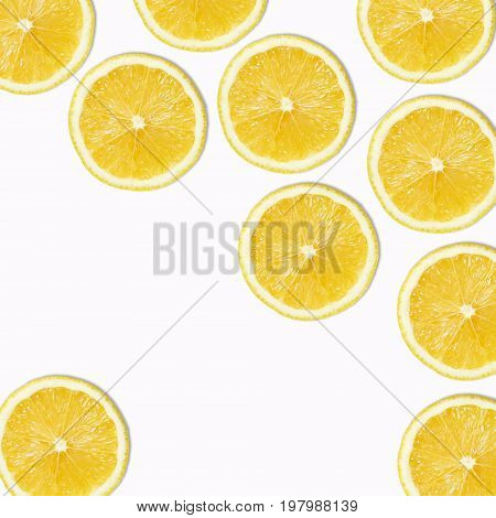 Seamless pattern of yellow lemon slices on white Background