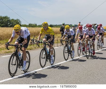 Mailleroncourt-Saint-Pancras France - July 5 2017: Geraint Thomas in Yellow Jersey riding in the peloton between his teammates on a road to La Planche des Belle Filles during the stage 5 of Tour de France 2017.