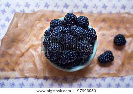 Homemade, sweet, delicious blackberries in a handmade dish