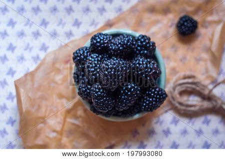 Homemade, sweet, delicious blackberries in a handmade dish