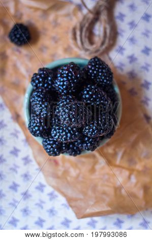 Homemade, sweet, delicious blackberries in a handmade dish