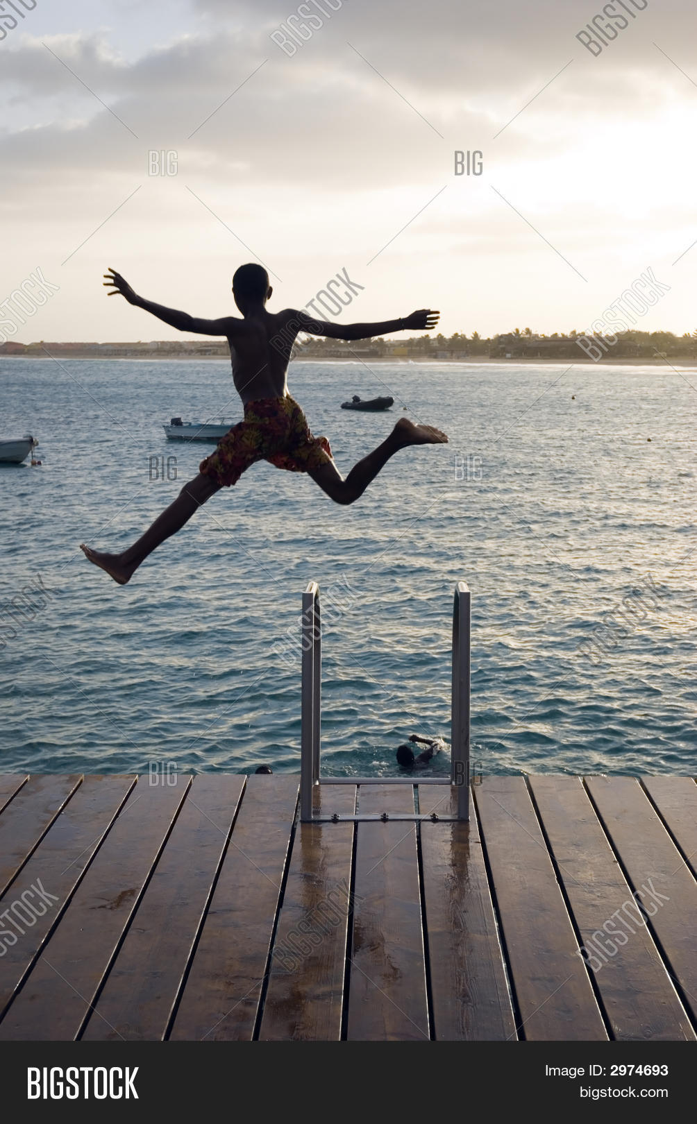 Boy Jumping Off Pier Image & Photo (Free Trial) Bigstock