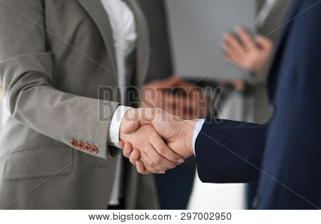 Business People Shaking Hands At Meeting Or Negotiation, Close-up. Group Of Unknown Businessmen And 