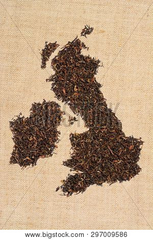 Loose Black Tea. The Contour Of The Great Britain Is Made From England Breakfast Tea On Homespun Lin