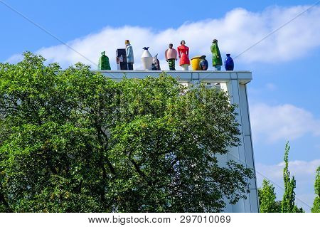 Lubeck, Germany - August 16, 2018: Strange Figures On The Roof Of Music And Congress Centre Of Lubec