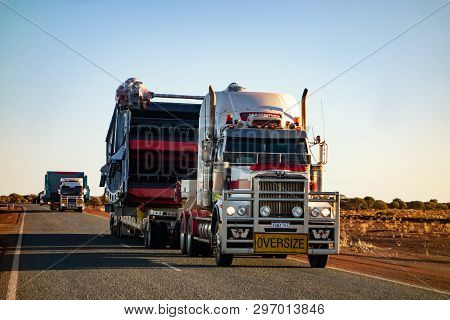 Western Australia - July 11, 2018: White Western Star Truck With Red Stripes Driving On An Outback R