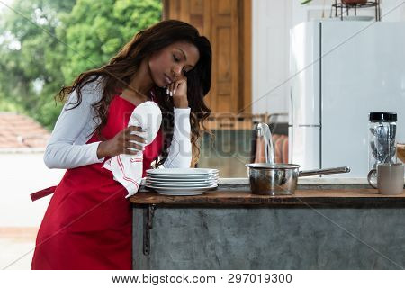 Frustrated African American Housewife At Kitchen At Home