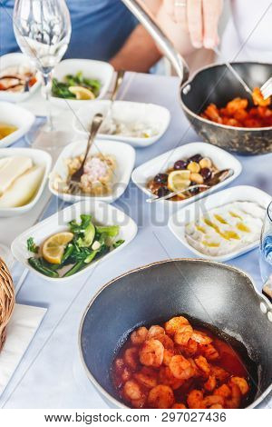 Saganaki And Meze Appetizers At The Local Greek Restaurant. Healthy Seafood And Vegetarian Snacks. L