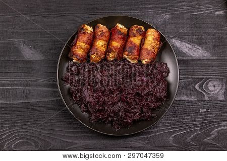 Fried Homemade Grilled Sausages Or Chevapchichi With Stewed Sauerkraut On A Wooden Rustic Background