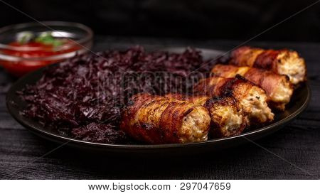 Fried Homemade Grilled Sausages Or Chevapchichi With Stewed Sauerkraut And Tomato Sauce On A Wooden 