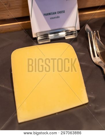 parmesan cheese on black stone plate in buffet line