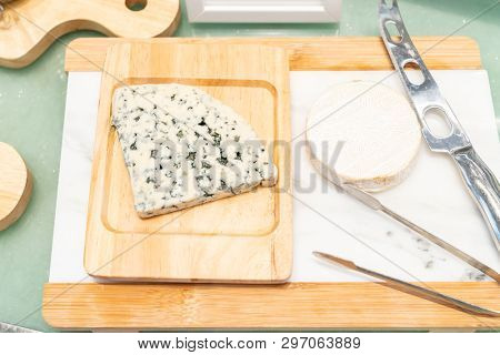 Blue Cheese on rustic wooden table in buffet line