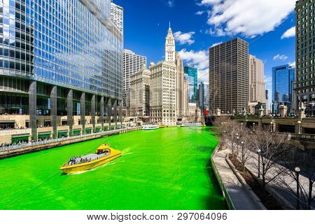 Chicago Skylines building along green dyeing river of Chicago River on St. Patrick's day festival in Chicago Downtown IL USA