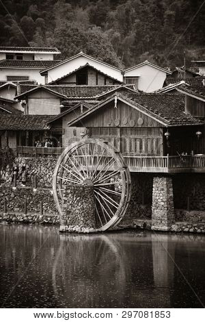 FUJIAN, CHINA â MARCH 2, 2018: Yunshuiyao old town by the river with watermill in Fujian, China.