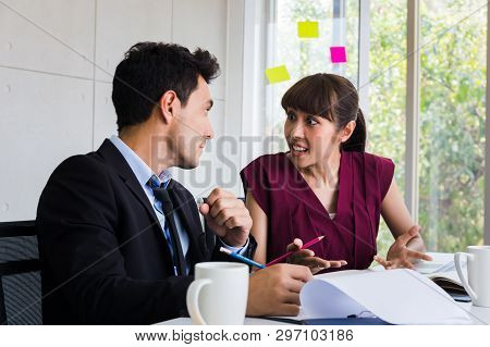 Two Multi-ethnic Business People In Formal Suit Having The Astonishing And Excited News To Talk Abou