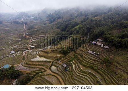 Aerial View Of Green Terraced Rice Fields And Building On The Valley At Cat Cat Village In Sapa, Vie