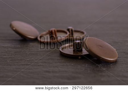 Group Of Five Whole Brown Plast Caplugs Work Item On Grey Stone
