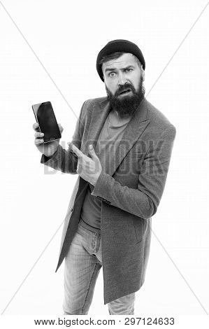 User Outraged. Man Brutal Bully Appearance Hold Smartphone Isolated White. Bearded Brutal Guy Pointi