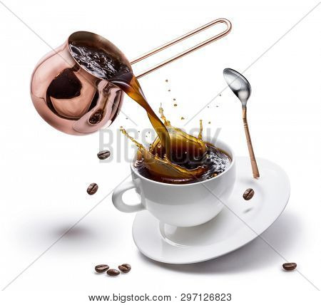 Coffee preparation. Conceptual photo - pouring coffee from copper pot into a cup.