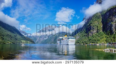 Hurtigruten Cruise Liner Sailing On The Geirangerfjord, One Of The Most Popular Destination In Norwa