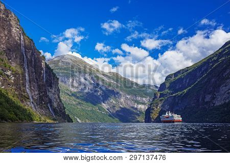 Hurtigruten Cruise Liner Sailing On The Geirangerfjord, One Of The Most Popular Destination In Norwa