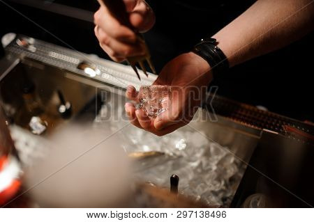 Close-up Of Bartender Crushing Ice With Ice Crusher