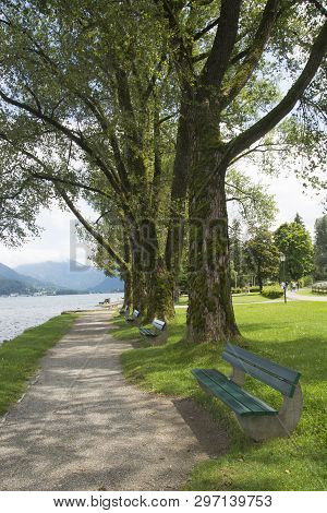 Benches At The Waterfront At Lake Tergensee In Germany On A Summer Afternoon
