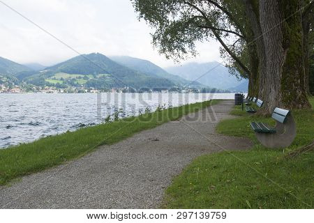 Benches At The Waterfront At Lake Tergensee In Germany On A Cloudy Afternoon