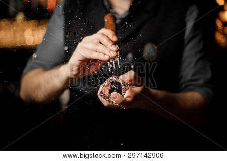 Close-up Of Bartender Crushing Ice With Ice Crusher