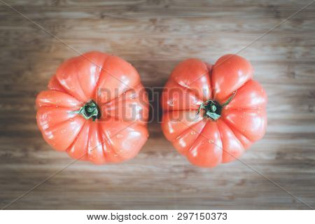 Oxheart Tomatoes. Tomatoes On A Bamboo Wood Plate.