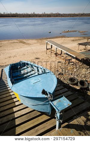 Boat On The Slopes In Anticipation Of The Arrival Of Water. Low Water Level In The River. Drought In
