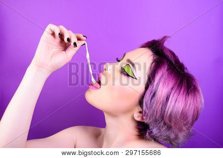 Girl Stretches The Cud. Sexy Girl With Short Hair. Portrait Of A Woman With Bright Colored Hair, All
