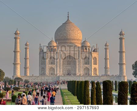 Agra, India - March 5 2018: Tourists Sighteseeing, Exploring And Admiring Famous The Taj Mahal