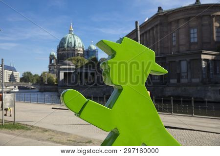 Berlin, Germany; August 2018; Ampelmann And Berliner Dom By The River Spree
