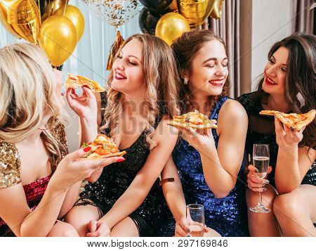 Girls Party. Close Female Friends Sitting In Room Decorated With Balloons, Having Fun. Lady Sharing 