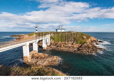 Pancha Island Lighthouse In Ribadeo Coastline, Galicia, Spain.