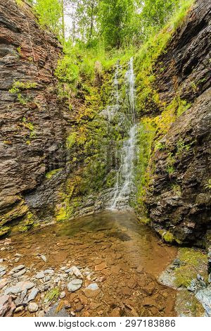 Little Waterfall In Green Summer Mountains, Norway.