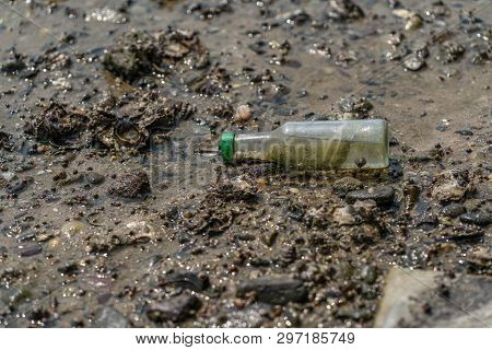 Small Glass Bottle  On Sea Shore