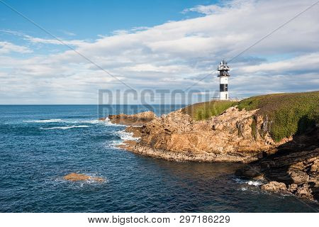 Pancha Island Lighthouse In Ribadeo Coastline, Galicia, Spain.