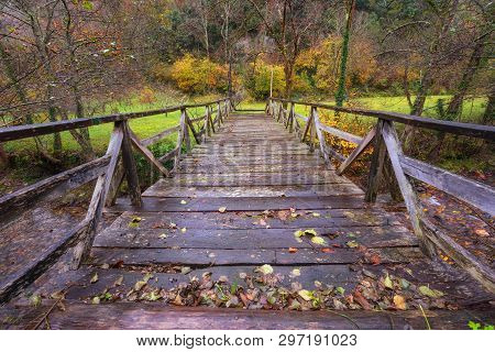 Wooden Bridge Over River In Somiedo Natural Park, Asturias, Spain